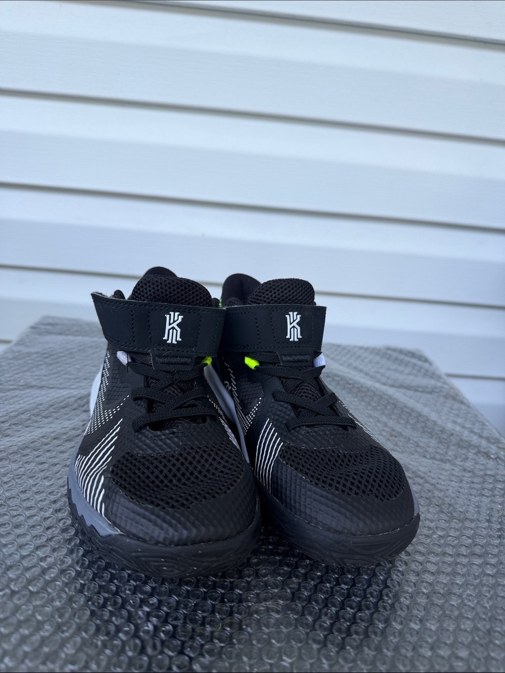 Nike Kids Black and White High-Top Sneakers with Neon Accent